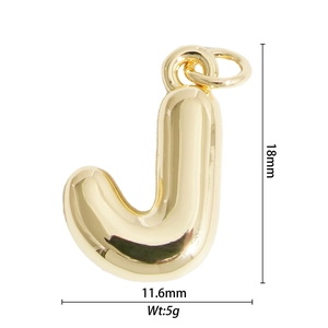 Macro shot of 18k gold bubble letter J pendant showing 18mm height and 11.6mm width details