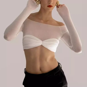 Detailed view of the semi-transparent white mesh fabric and ruched off-shoulder design
