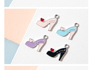 Macro shot of colorful high heel alloy charms with hearts for DIY jewelry making