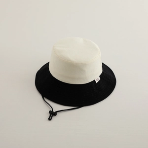 Detail shot of color-block kids sun hat with adjustable windproof cord and side label