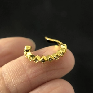Golden cubic zirconia non-piercing cartilage ear cuff shown on model for women