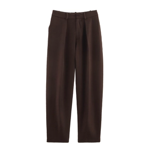 Close-up of deep brown high-waisted tailored trousers in premium woven fabric