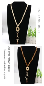 Detail of Nordic wooden bead lanyard with rattan circle pendant and brown tassel decoration