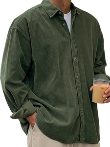 Detail of dark green corduroy fabric texture and collar on a warm men's long sleeve shirt