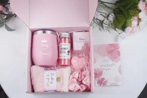 Detail view of pink spa gift set with tumbler, rose bath salts and scented candle