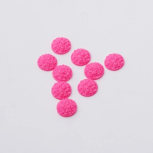Detail of 12mm pink resin druzy round cabochons with sparkling flatback surface for DIY