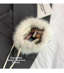 Top view showing the spacious interior of white faux fur bucket bag for daily items