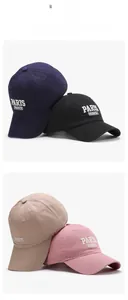 Detailed view of four cotton baseball caps in navy, black, khaki and pink colors