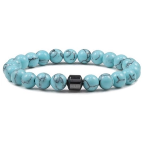 Macro detail of 8mm turquoise beaded bracelet showing natural texture and black hematite spacer