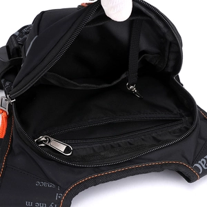 Detailed interior of the tactical leg bag showing the zipper pocket and orange stitching