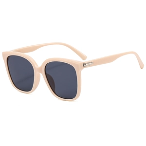 Occhiali da sole oversize beige con montatura quadrata, lenti scure e metallo