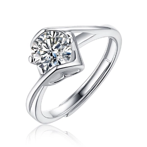 Detailed macro view of the round brilliant cut moissanite set on a silver adjustable ring