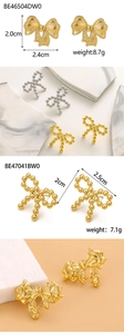 Detail view of 14K gold butterfly stud earrings with size and weight specifications