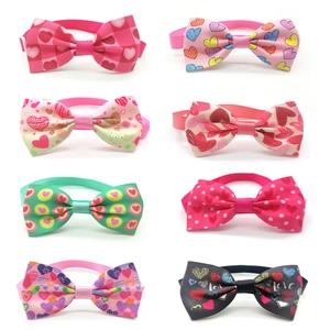 Set of 8 Valentine's dog bow ties with heart patterns and Love print on white background