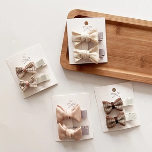 Cute bow hair clips set for girls featuring houndstooth and satin fabric designs