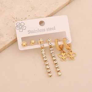 Golden stainless steel earring set featuring long rhinestone studs and butterfly charms