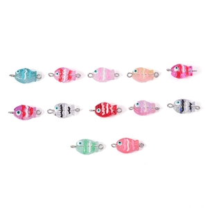 Hand-painted glass fish pendants in multiple colors with metal loops for jewelry making