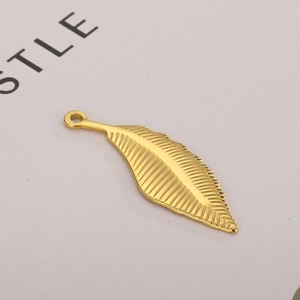 Polished gold stainless steel feather pendant necklace charm with detailed texture