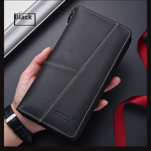 Detail of black long leather wallet featuring pebbled texture and contrast stitching