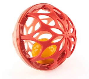Detail of baby Manhattan rattle ball with soft red hollow mesh and internal yellow sphere