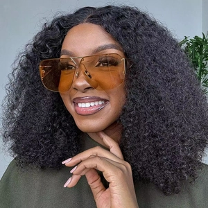 Premium aviator sunglasses with amber lenses and gold metal bridge worn by a model