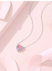 Detail of 925 sterling silver necklace with pink heart-shaped zircon and silver chain