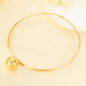 Minimalist gold stainless steel choker necklace featuring a large hollow sphere pendant