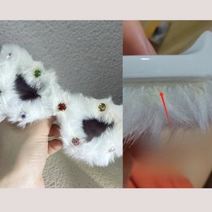 Detailed view of white faux fur sunglasses with colorful rhinestones and hot-cut edges