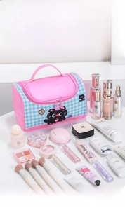 Pink checkered cartoon cat makeup bag with wide handle showing large storage capacity