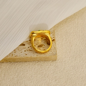 Luxury gold texture ring with turquoise zirconia and protective eye detail for women