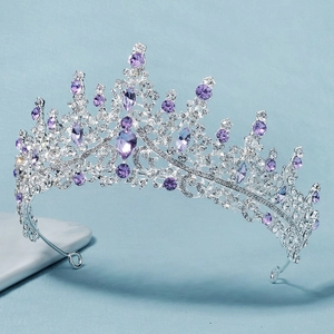 Macro detail of luxury bridal tiara with purple crystals and silver floral engravings