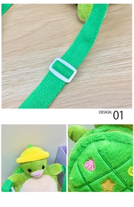 Detail view of plush green turtle bag showing adjustable strap and embroidered back texture