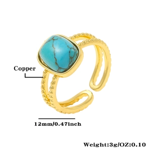Macro shot of 12mm turquoise stone and layered copper band with golden plating