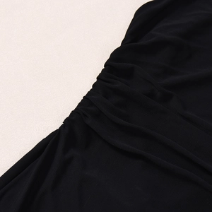 Detailed macro shot of black breathable mesh fabric with elegant pleated texture detail