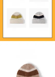 Detail of color-block striped wool knit beanie showing thick texture and folded cuff