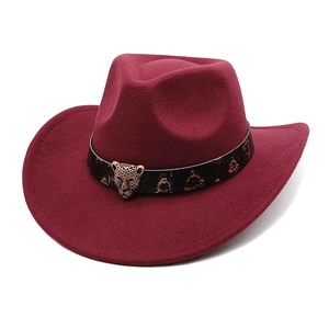 Detail of burgundy wool western cowboy hat featuring a vintage bronze leopard metal buckle