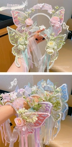Detail of floral butterfly headband with silk roses, pearls, and lace ribbons for girls