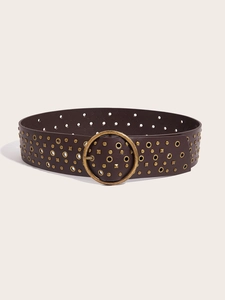Detail of wide brown PU leather belt with vintage brass round buckle and metal rivets