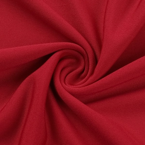 Close-up of the elegant red knitted fabric showing soft texture and fine material details