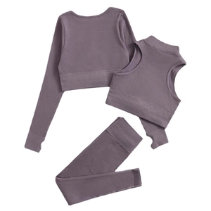 Three-piece purple ribbed yoga set featuring long sleeve top, sports bra, and leggings