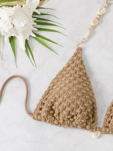 Detail of khaki bubble textured bikini top with shell and gold ring strap accents