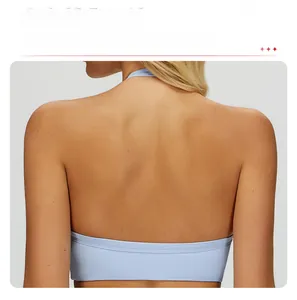 Detail view of the open back cutout and strappy design on light blue yoga sports bra