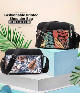Detail of floral printed oxford bags with multiple compartments and adjustable nylon straps