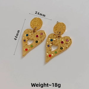 Detail view of 24mm x 44mm gold heart earrings with hammer finish and colorful rhinestones