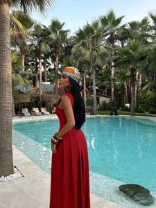 Elegant red off-shoulder maxi dress with pleated skirt and headscarf for summer parties