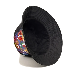 Reversible black graffiti bucket hat with colorful peace sign print and cotton brim