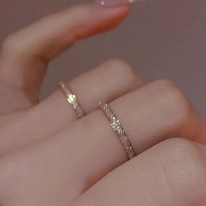 Frosted stainless steel rings with minimalist sandblasted finish on fingers