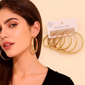 Set of minimalist gold stainless steel hoop earrings in five various sizes for women