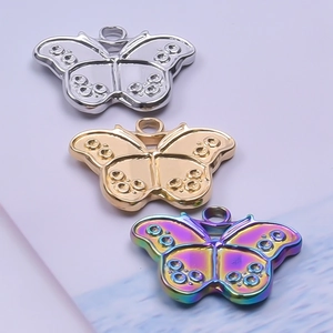 Polished stainless steel butterfly pendants in silver, gold, and rainbow finishes