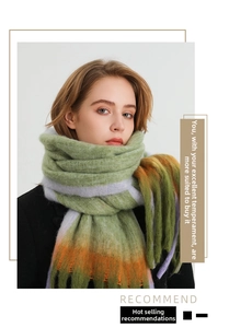 Detail of color-block knit scarf with green, orange, and purple stripes and long tassels
